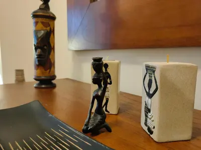 a candle and a statue of a woman on a table at NON STRESS Arena Primera línea de Playa in Valencia