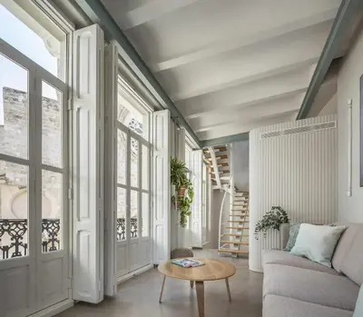 a living room with a couch and a table at APARTAMENTO CENTRO DE VALENCIA PRECIOSA TERRAZA in Valencia