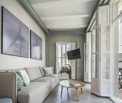 a living room with a couch and a table at APARTAMENTO CENTRO DE VALENCIA PRECIOSA TERRAZA in Valencia