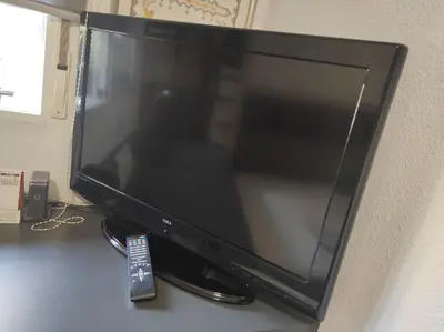 a computer monitor sitting on top of a desk at Comoda y moderna HABITACION DOBLE in Valencia