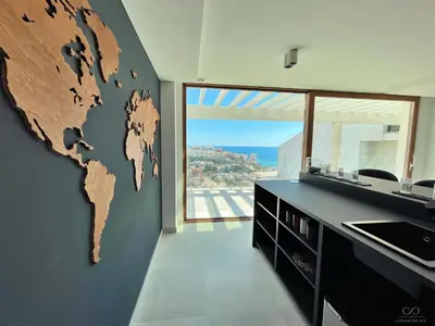 a bathroom with a large world map on the wall at Colina del Sol Cullera - Villa Sol in Cullera
