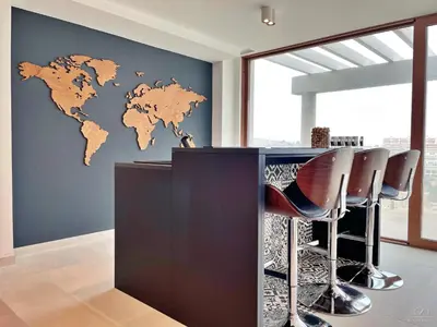 a room with a bar with a world map on the wall at Colina del Sol Cullera - Villa Sol in Cullera