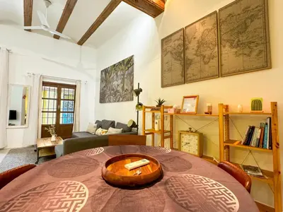 a living room with a table and a couch at Acogedor piso en el corazon del Casco Historico in Valencia