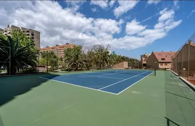 a tennis court with a tennis court at Palau de Vic in Valencia