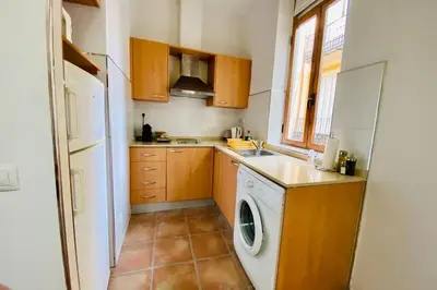a kitchen with a washer and a dishwasher at Acogedor loft en centro histórico in Valencia