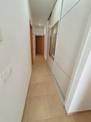 a hallway in an office building with a tile floor at Luxury Apartments Puerto Valencia in Valencia