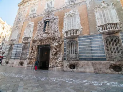 an old building with a door and windows on a street at MD Vitoria City Center in Valencia