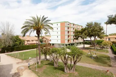 an aerial view of a park with a playground at Global Vacacional, Apartamento con terraza y piscina a un paso de la playa in Canet de Berenguer