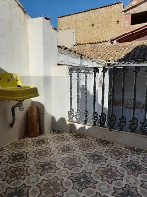 a bathroom with a sink and a tile floor at La Gata Mala in Navarrés