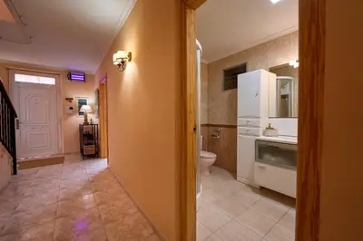 a bathroom with a sink and a toilet in a room at Casa Rural 