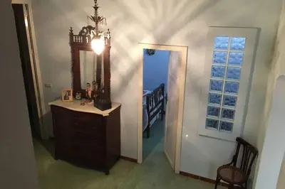 a room with a mirror and a dresser and a staircase at Casa de Pueblo en Navarres in Navarrés