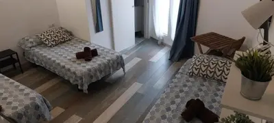 a living room with a bed and a couch at SERRANO Home in Valencia