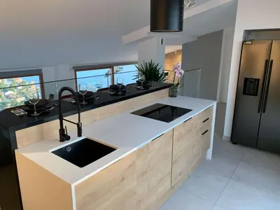 a kitchen with a sink and a counter top at Colina del Sol Cullera - Villa Luna in Cullera