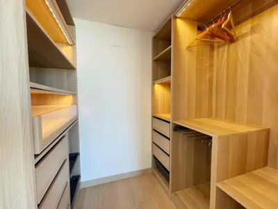 a walk in closet with wooden shelves and a wooden table at Colina del Sol Cullera - Villa Luna in Cullera