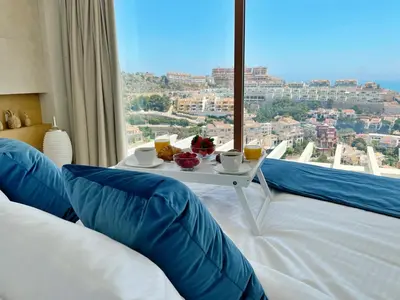 a room with a table and a large window at Colina del Sol Cullera - Villa Luna in Cullera
