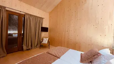 a bedroom with a bed and a chair in it at Casa Rural La Cabrentà in Estubeny