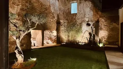 a room with a tree in the middle of a building at Casa Rural La Cabrentà in Estubeny