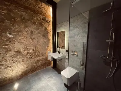 a bathroom with a sink and a toilet and a shower at Casa Rural La Cabrentà in Estubeny