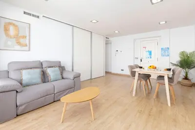 a living room with a couch and a table at Travel Habitat - Ático Centro in Valencia