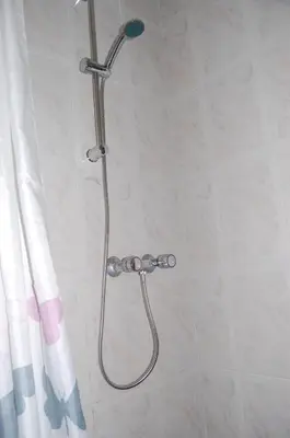 a shower with a shower head in a bathroom at CASICA TIA CARMEN in Chulilla