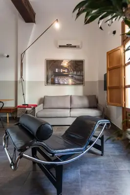 a bed with two pillows on it in a room at BUBUFLATS / Mercat in Valencia