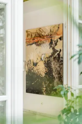 a painting hanging on a wall next to a window at Apartamento Reina Catedral in Valencia