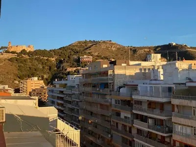 a group of buildings on top of a mountain at Apto POSEIDON CON PARKING EN EDIFICIO SUBTERRANEO in Cullera