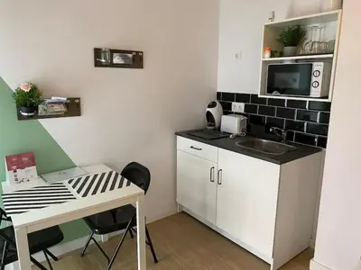 a small kitchen with a sink and a microwave at COOL LOFTS center valencia in Valencia