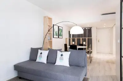 a living room with a couch and a dining room at Loft en el corazón de Valencia in Valencia