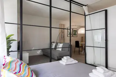 a bedroom with a large glass wall at Loft en el corazón de Valencia in Valencia