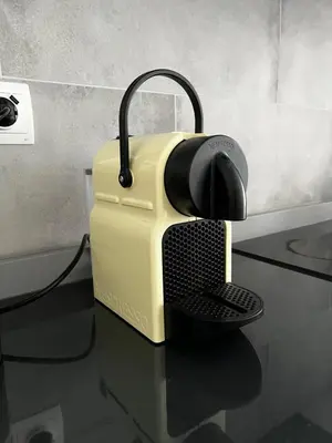 a yellow toaster sitting on a glass table at Apartment near the port, City Of Arts and 10min to the beach in Valencia
