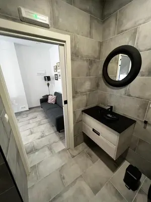 a bathroom with a sink and a mirror at Apartment near the port, City Of Arts and 10min to the beach in Valencia