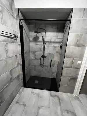 a bathroom with a shower with a glass door at Apartment near the port, City Of Arts and 10min to the beach in Valencia