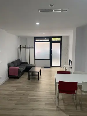 a living room with a couch and a table at Cozy flat in La Petxina_A in Valencia