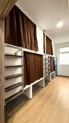 a room with brown curtains on the wall at Beach & Arts Hostel Valencia in Valencia