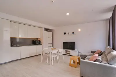 a living room with a couch and a table at aeropuerto loft polígono in Manises