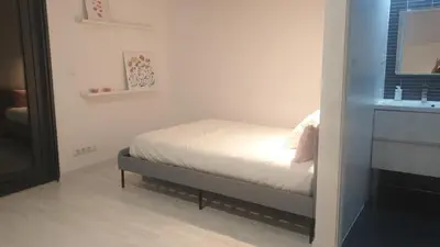 a small bedroom with a bed and a window at aeropuerto loft polígono in Manises