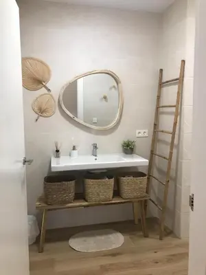 a bathroom with a sink and a mirror at Apartamento equipado playa Valencia OnesDeMar in Valencia