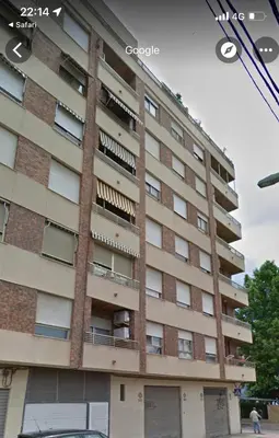 a tall brick building with windows on the side of it at UIM Mediterraneo ATICO San Pedro Wifi in Puerto de Sagunto