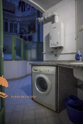 a washer and dryer in a room at Patacona Green Holiday in Valencia