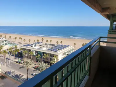 a view of the beach from the balcony of a resort at Patacona Green Holiday in Valencia