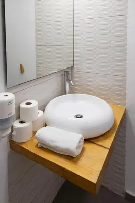 a bathroom with a white sink and a mirror at Benlloch Silence in Valencia