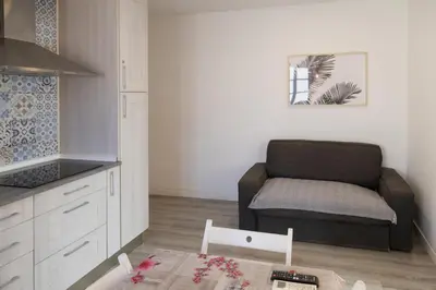 a small living room with a couch and a table at Benlloch Silence in Valencia