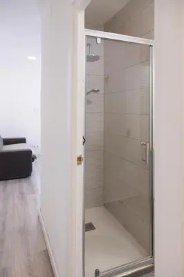 a shower in a bathroom with a glass door at Benlloch Silence in Valencia