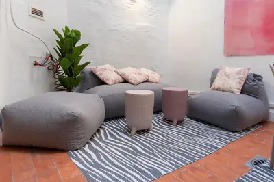 a living room with a couch and two chairs at Moontels Paseo de Ruzafa in Valencia