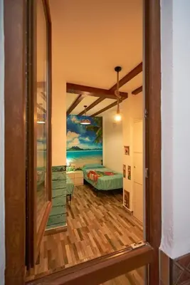 a room with a bedroom with a bed in it at Casa ideal para familias con patio y 3 baños in Valencia