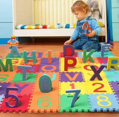 a young child playing with a toy on a play mat at Casa ideal para familias con patio y 3 baños in Valencia