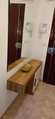 a bathroom with a sink and a mirror at City apartment in Valencia