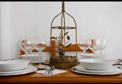 a table with plates and wine glasses on it at City apartment in Valencia