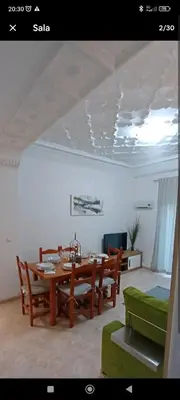 a dining room with a table and chairs at City apartment in Valencia
